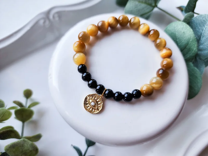 Shop Jewelry That Shines Without The High Price Golden Tiger's Eye, Onyx, & Evil Eye Charm Bracelet || Reiki Infused